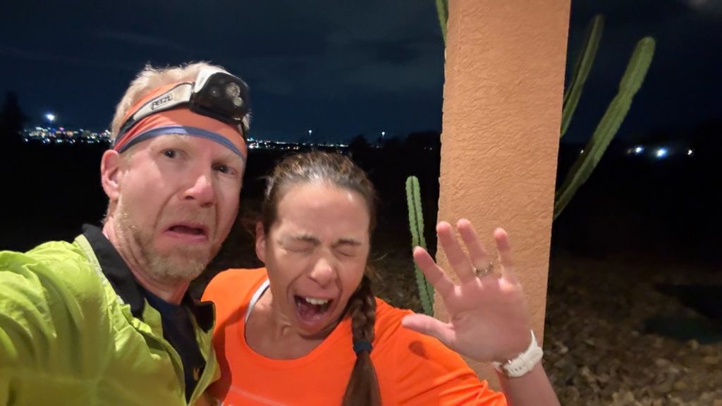 Nathan Whittacre and Joyce Forier during a night run, visibly fatigued, showing the mental and physical toll of the 4x4x48 challenge.